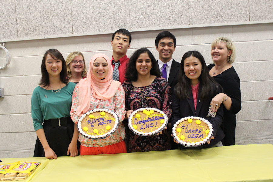 Latin+teachers+Patricia+Lister+and+Christine+Conklin+stand+with+several+of+the+senior+Latin+Honor+Society+%28LHS%29+board+members%2C+Bobbie+Sheng%2C+Reem+Mohammad%2C+Orchi+Banerjee%2C+Rachel+Chon%2C+Peter+Kim+and+Nolan+Kataoka%2C+with+the+cakes+at+the+LHS+induction+ceremony+on+Oct.+22.
