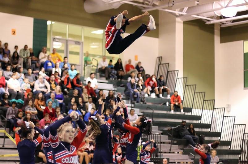 The Jefferson cheerleading team opened the routine at District Finals with the  basket toss of senior Daniel Suh.