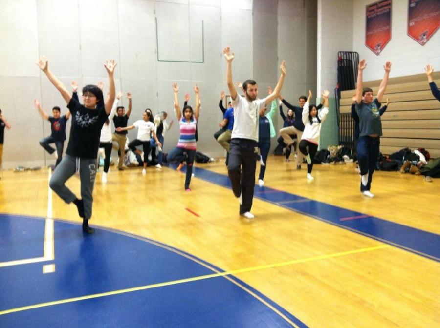 Students stretch during the yoga activity during eighth period held on Feb. 11.