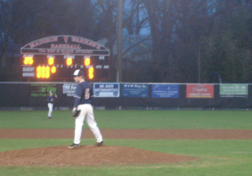 Pitcher Sam Case practices pitching balls during the middle of the fourth inning.