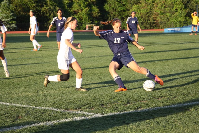 Junior Maaike Blindenbach passes the ball up the field in the Capitol Conference Semifinal game.