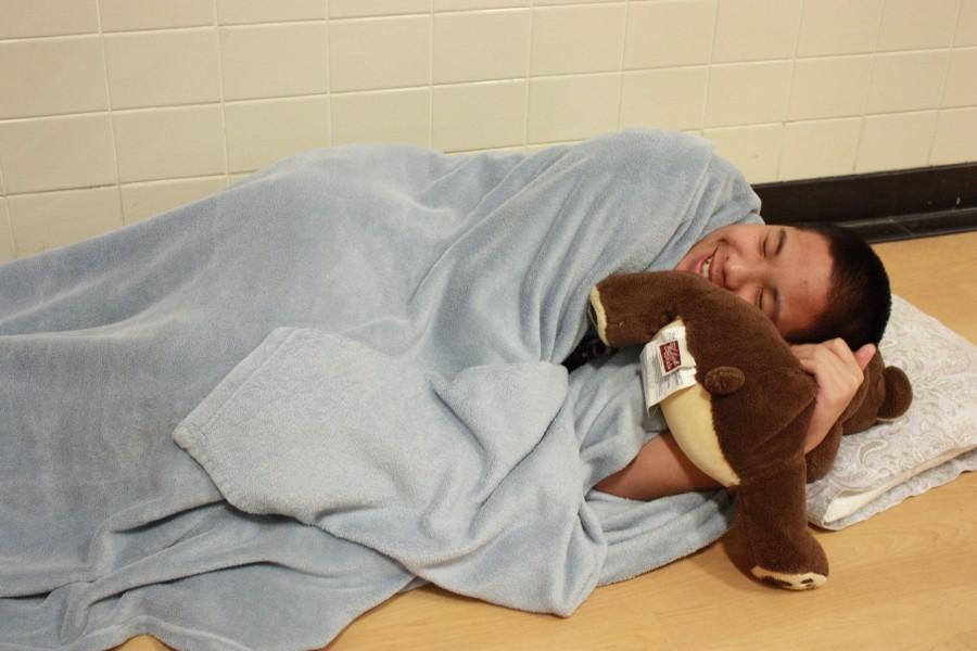 Sophomore Sean Tran brings a blanket, pillow and stuffed animal to school for Pajama Day on April 27.