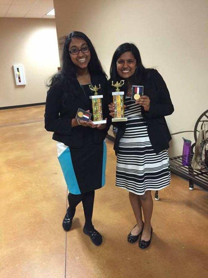 Juniors Kiran Girish and Sahana Ramani show off the awards they have won for debate.