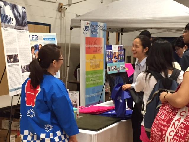 Senior Bridget Park talks to one of the representatives of AIST, a Japanese research facility that developed Paro, a therapeutic robot. 