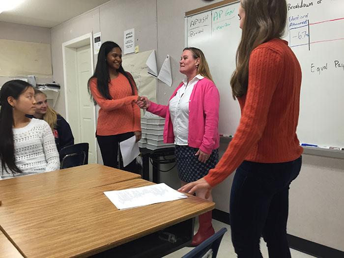 Students listen to Professor Angela Hattery discuss the gender wage gap