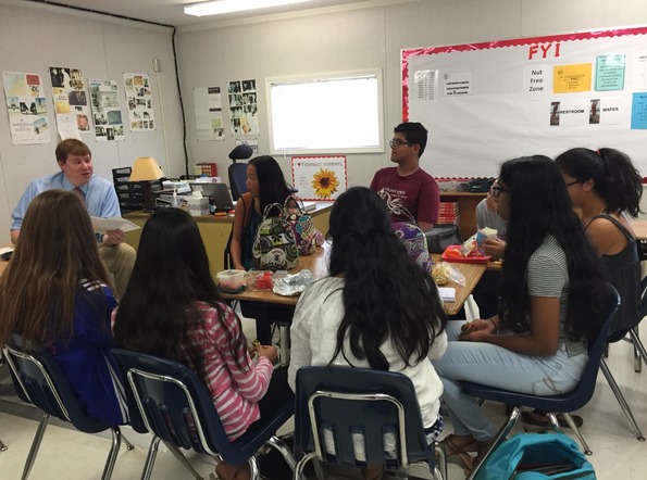 Class of 2019 FroshComm members meet with their class sponsors during lunch to prepare for homecoming week.