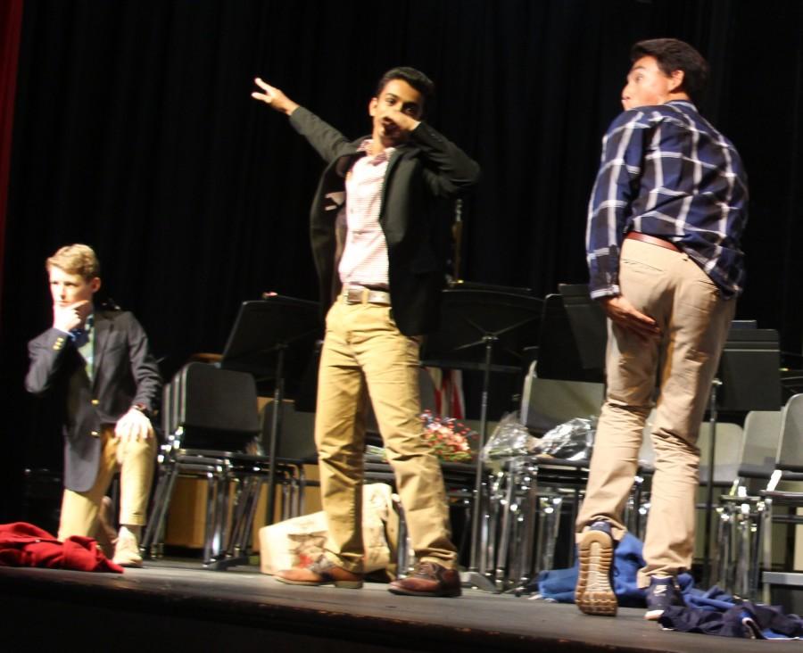 Juniors CJ Wilson, Sishaar Rao, Nick Yoon, and Jack Schefer (not pictured) ask four girls to homecoming in the auditorium during break Wednesday afternoon.