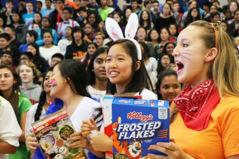 Sophomores Jade Wang and Maggie Kirtley cheer on the class of 2018