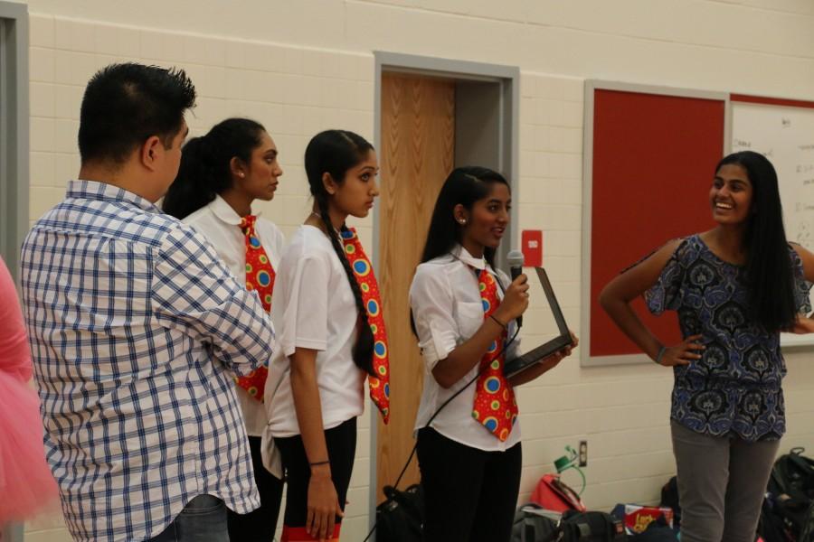 Sophomores Jahnavi Prabhala, Sahana Aiyer, Shivani Mullapudi and Shreya Chappidi and class sponsor Charles delaCuesta lead the Class of 2018s MEX rehearsal.