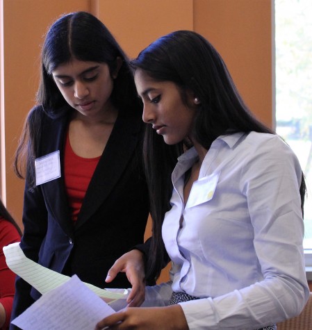 Sophomores Shivani Mullapudi and Shriie Ganesh used lunch breaks during the William and Mary High School Model United Nations conference to perfect their working paper on global immunization.