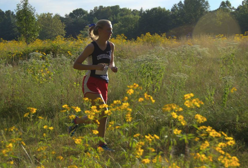 Sophomore+Margaret+Covey+runs+long+distance+during+a+cross+country+meet.