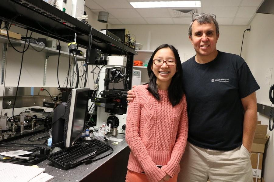 Eric Betzig shows Team Leader Katherine Du the initial models of his PALM microscope.