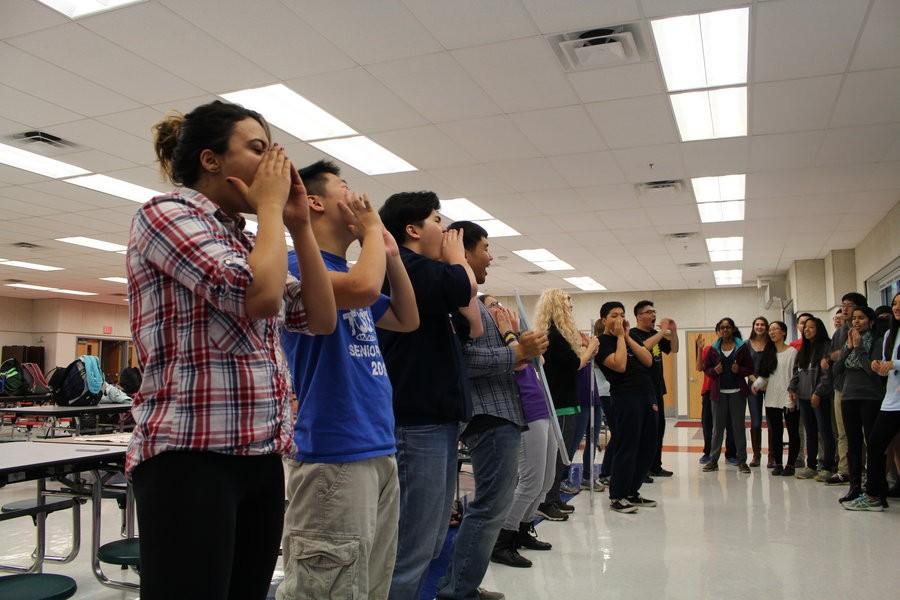 Latin club members demonstrate spirit cheers for the VJCL convention