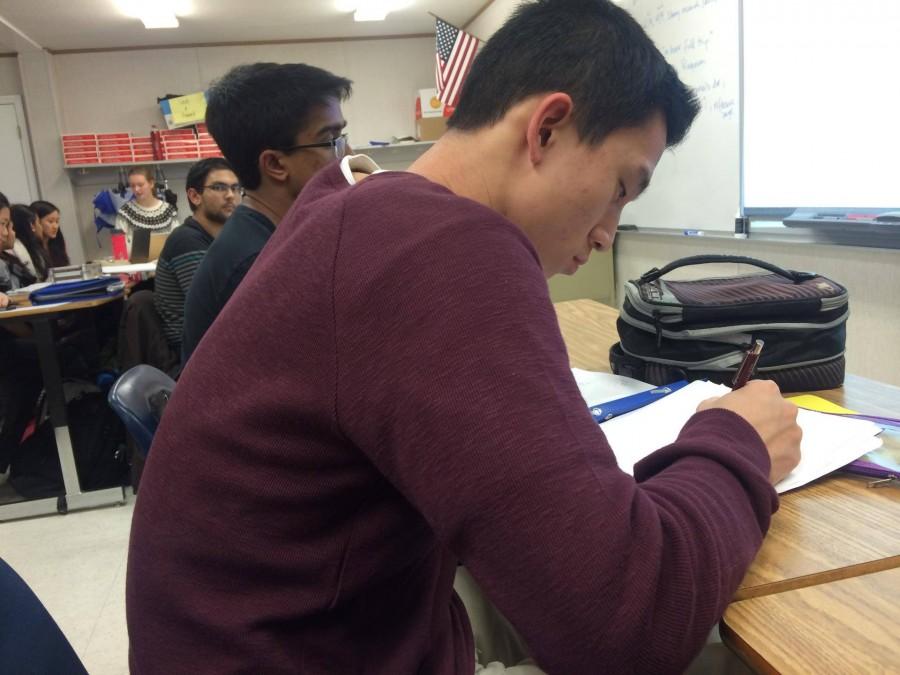 Senior Allen Cheng takes an exam at Jefferson, where final exams are still present.