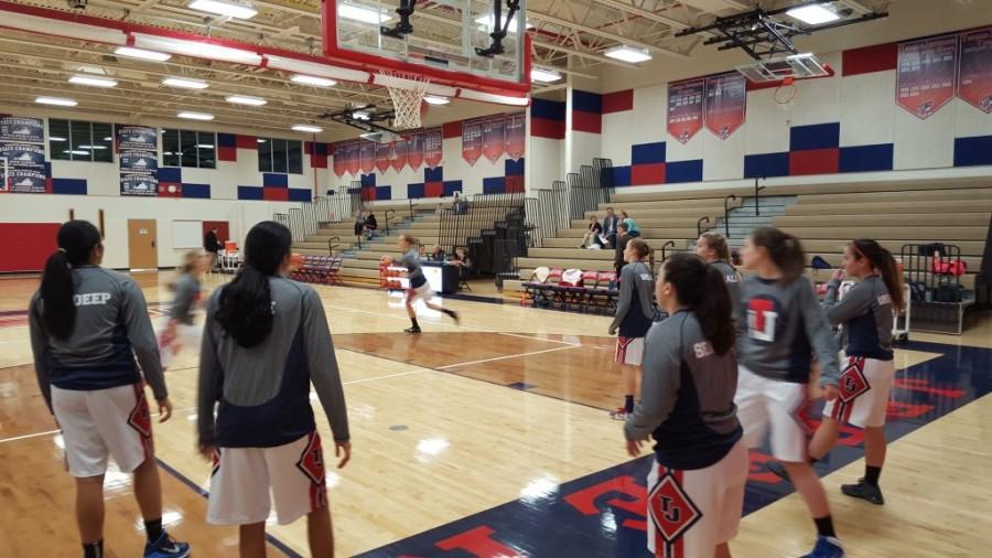 The Jefferson varsity girls basketball team prepares to play against Madeira