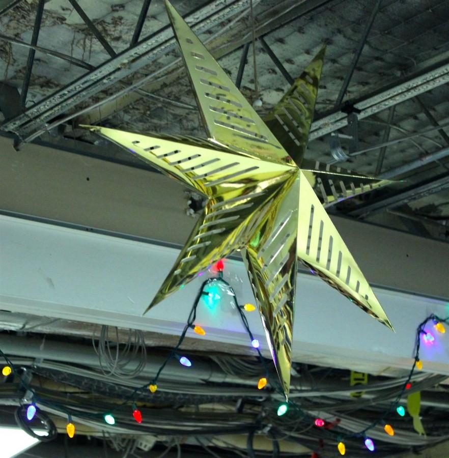 Vibrant lights and a golden star hang from the rafters on Thursday, December 10th. 