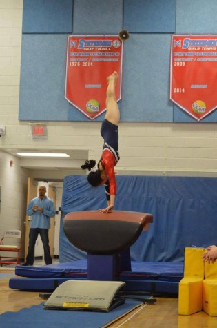 Sophomore Lilly Ko does a vault at TJ Gymnastics’ most recent meet at Falls Church High School in Falls Church, VA on Dec. 7, 2015.
