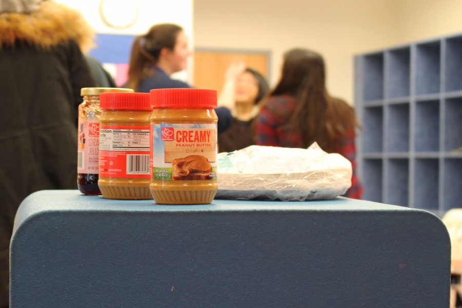 Participants at the Jefferson UNICEF club's sandwich making event on Feb. 19 placed left over peanut butter and jelly together while cleaning up the Einstein Commons. The sandwiches made at the event will be donated to a shelter.