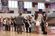 Dr. Glazer shakes hands with the senior dance team members.