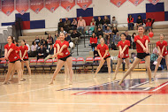 The dance team begins their half time performance.