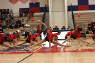 The dance team shows their flexibility with this dance move during the half time performance.