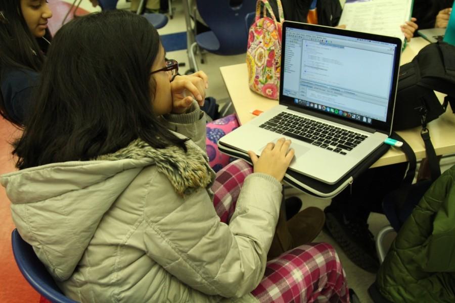 Feb. 22 was a school-wide pajama day for students during Mental Wellness Week. Sophomore Gulnaz Sayed works on her programming code while in pajamas in the Chem Commons.