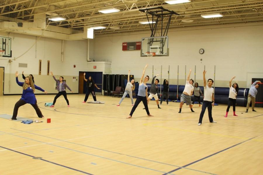 Active Minds held a yoga session for students on Feb. 24 for students to stretch and enjoy themselves as the school day came to an end. Students are led by instructor Heather Cunningham while doing a yoga pose during eighth period in the gym.