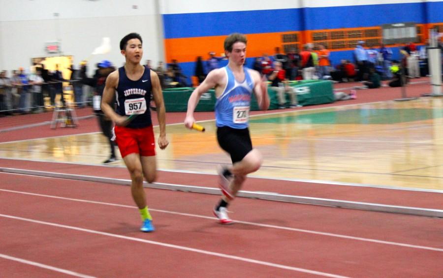 Sprinter Charlie Guan runs  his third and final event, the boys 4x200m relay.