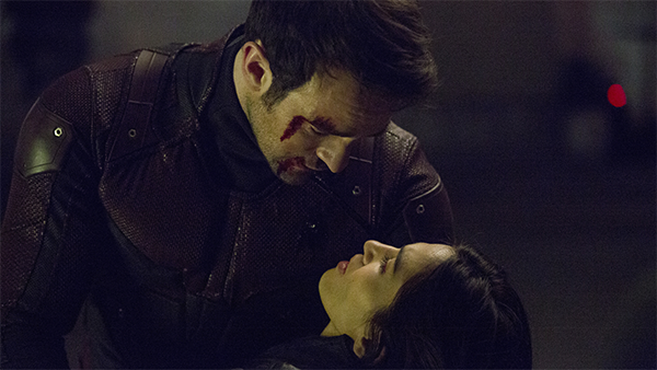 Matt Murdock (Charlie Cox) holds an injured Elektra (Elodie Yung).