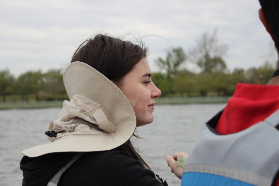 Junior Klara Vertes surveys the landscape from the back of the boat.