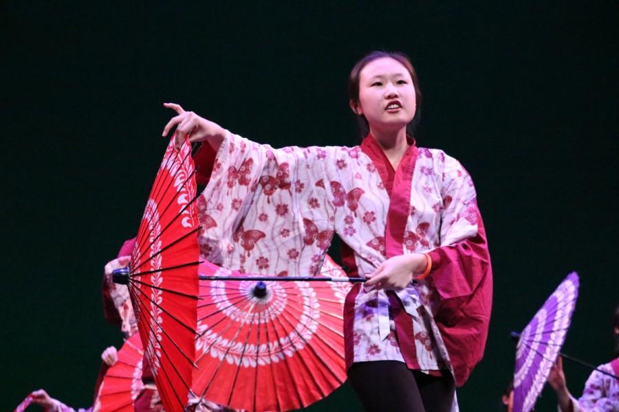 Senior Yeonju Kim gracefully moves across the stage during Japanese National Honor Society's (JNHS) performance.