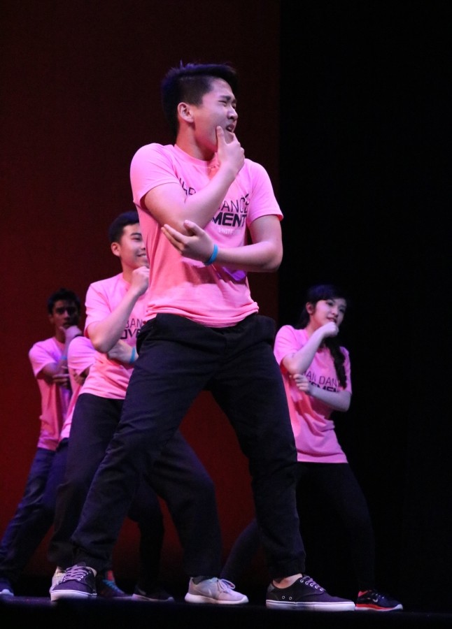 Sophomore Sean Ji poses as he dances along with the rest of Urban Dance Movement.