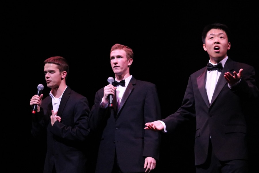 In between performances, the MCs kept the crowd entertained, such as when senior Andy Charbonneau (left) and MCs Jackson Zagurski (middle) and Andrew Huang (right) introduced Asian Awarenesss performance.