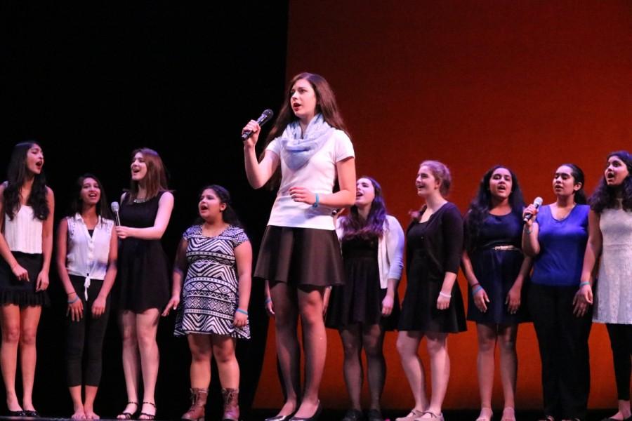 Showchoir wows the crowd with wonderful vocals as senior Olivia Marcantonio helps lead the performance with her solos.