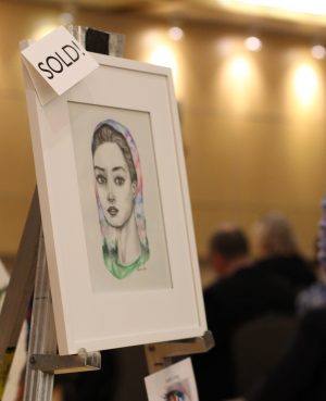 Sophomore Olivia Lu displayed and sold her drawing titled “Shield Me” at Artful Living on April 23.
