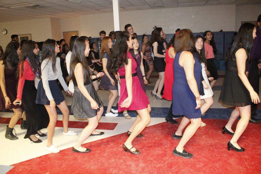 Students, joined by Señora Nannette Mateo, dance to the popular song "Wobble Baby" by V.I.C. at the end of Bulería.