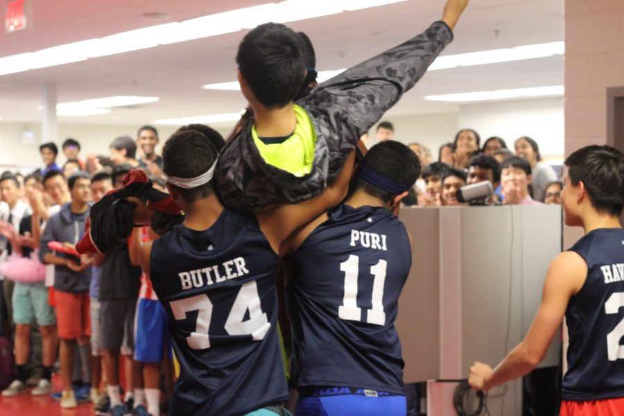 Sophomores Scott Becker, Andrew Butler, Sid Muralidhar, Anthony Thomas, and Joshua Havermale hoist Nathan Chen onto their shoulders and parade him around the commons.
