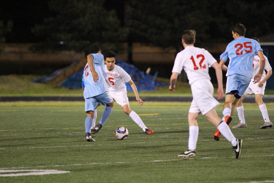 Sophomore Thomas Baron looks at junior Jack Schefer before passing to him.