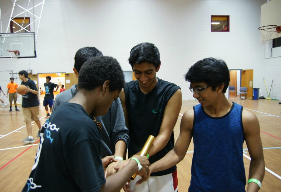 Maxwell Jones, Aditya Koneru, and Nikhil Bandaru get ready for the relay races.