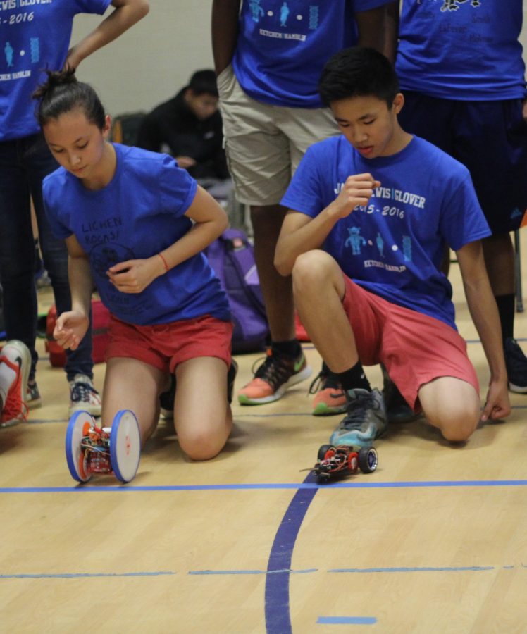 Alice Fontaine and Lance Nguyen watch their robots race.