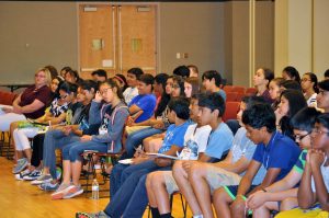 A group of middle school students listen to Prathik Naidus keynote speech at the beginning of the conference. Photo courtesy of Prathik Naidu.