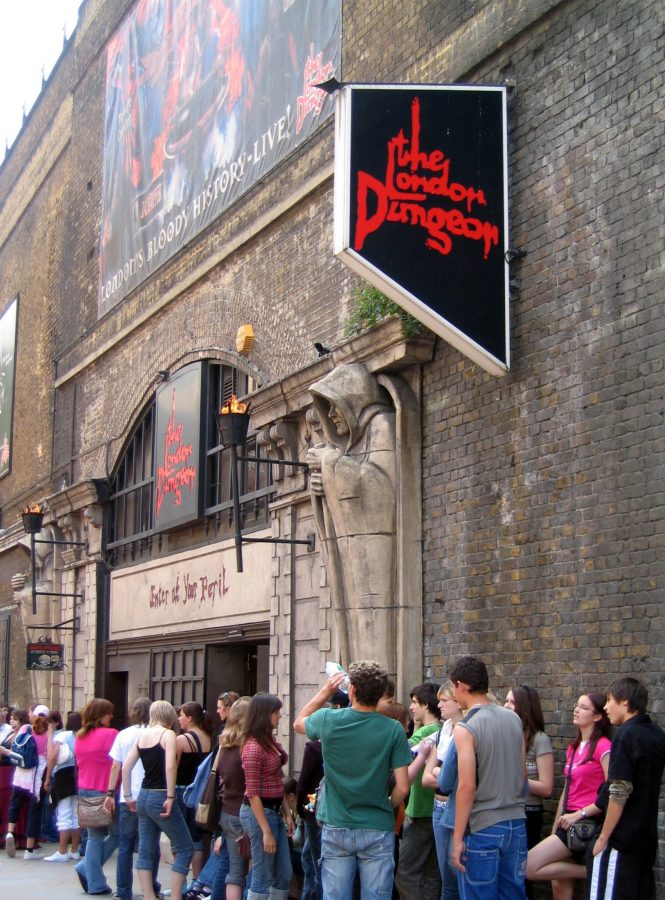 Tourists wait in line for an opportunity to experience the London Dungeon.