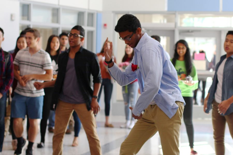 Junior Ishaan Dey performs a dance before asking sophomore Pari Parajuli to homecoming.