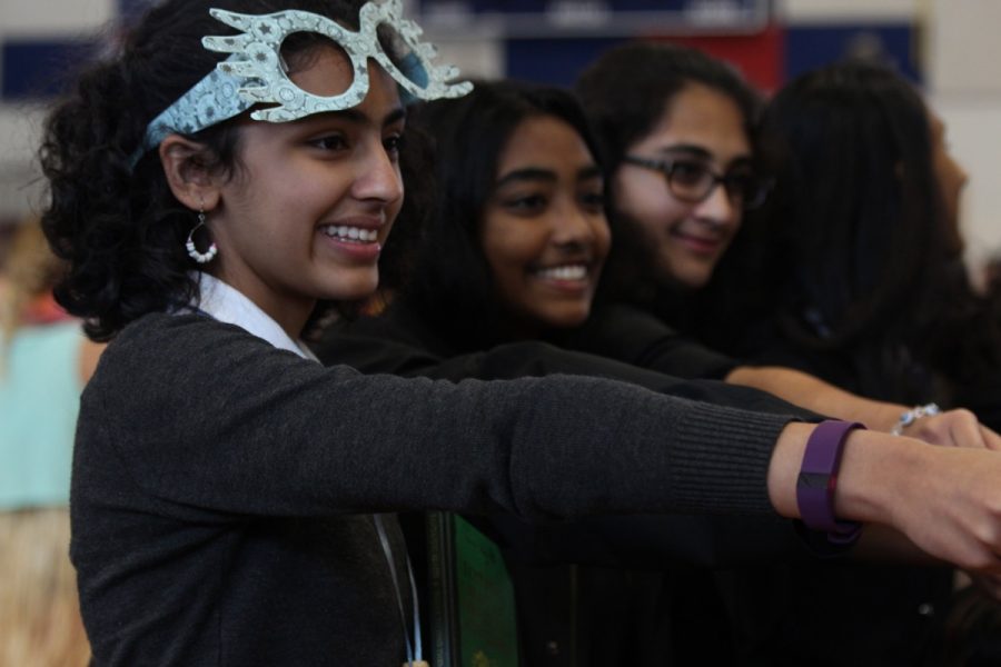 Freshman Aashni Manroa represents her class with the rest of her group at the pep rally on Oct. 12.