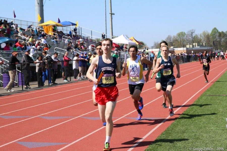 Junior Sean Clancy runs towards the finish line in a relay race.