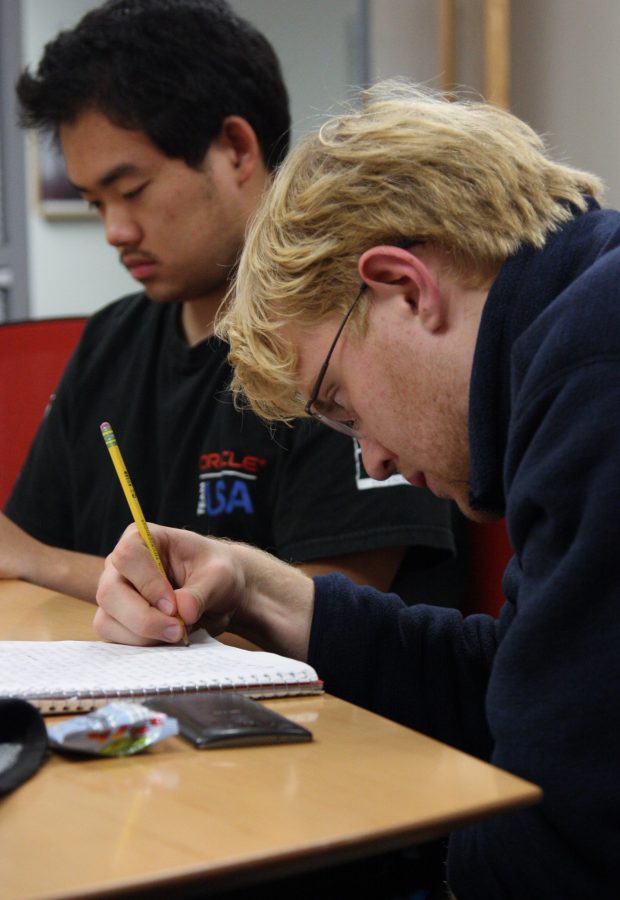 Junior Jack Mclaughlan jots down ideas to meet his daily NaNoWriMo word goal.