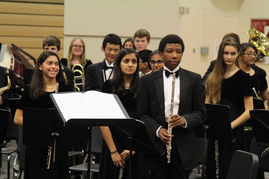 Turner Bumbary (right) proudly takes his bow with the rest of the Symphonic Band after a successful performance.