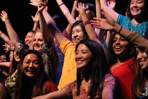 Students slide to the front of the stage in the finale of iNite's Namaste Senior Girls act.