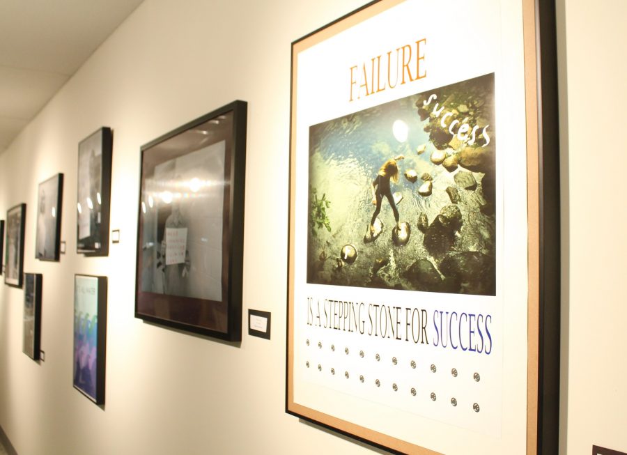 Senior Audrey Huang’s graphic art design, “Failure” hangs on the art gallery wall along with other submitted artworks.