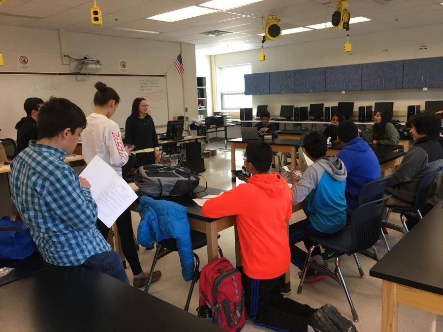 The Congressional Debate team listening and taking notes during a lunch meeting to their captain Victoria Bevard. The team was preparing for an upcoming tournament.